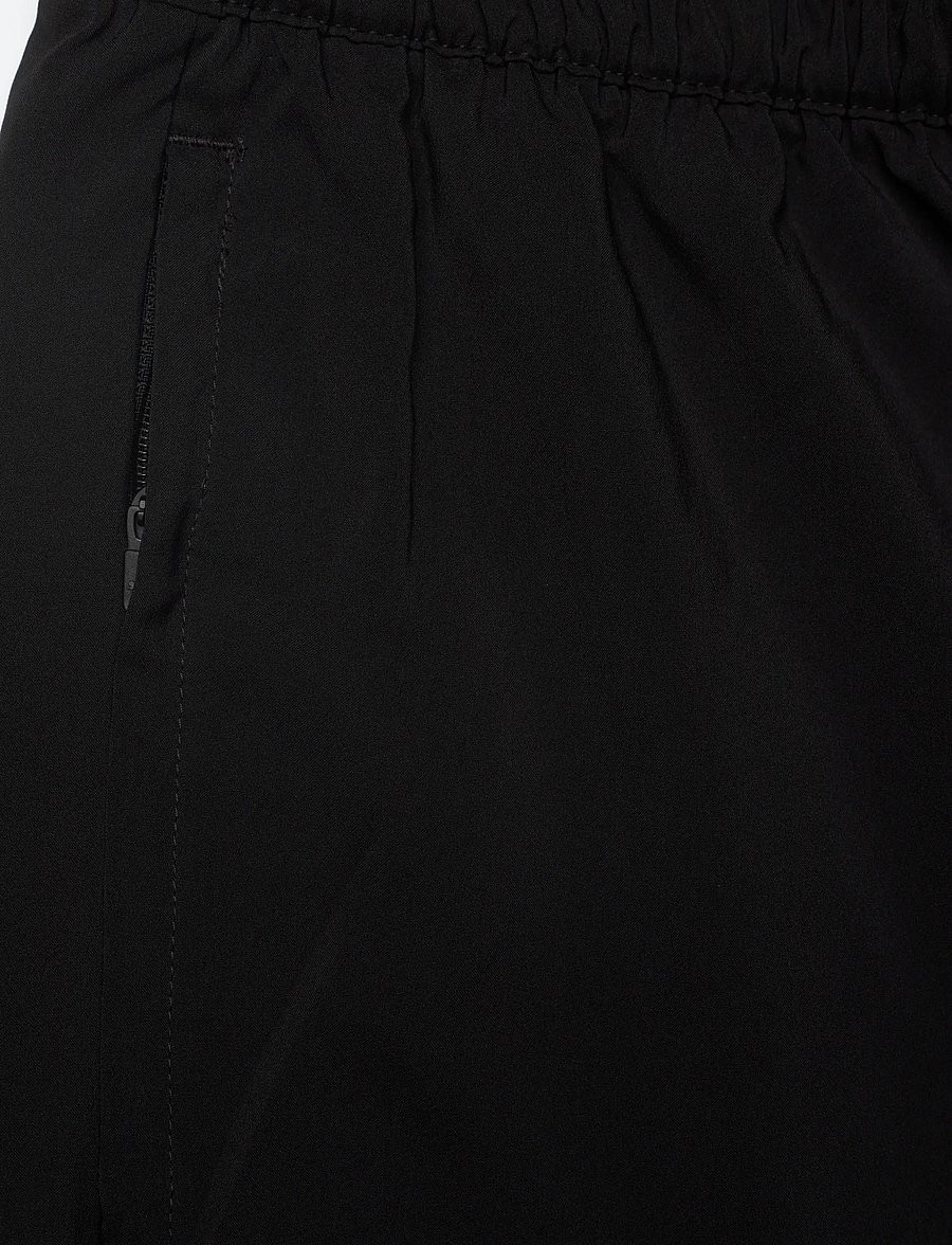 Detail close-up of drawstring waist and zip pocket on PUMA Foundations Training Shorts 2071451.