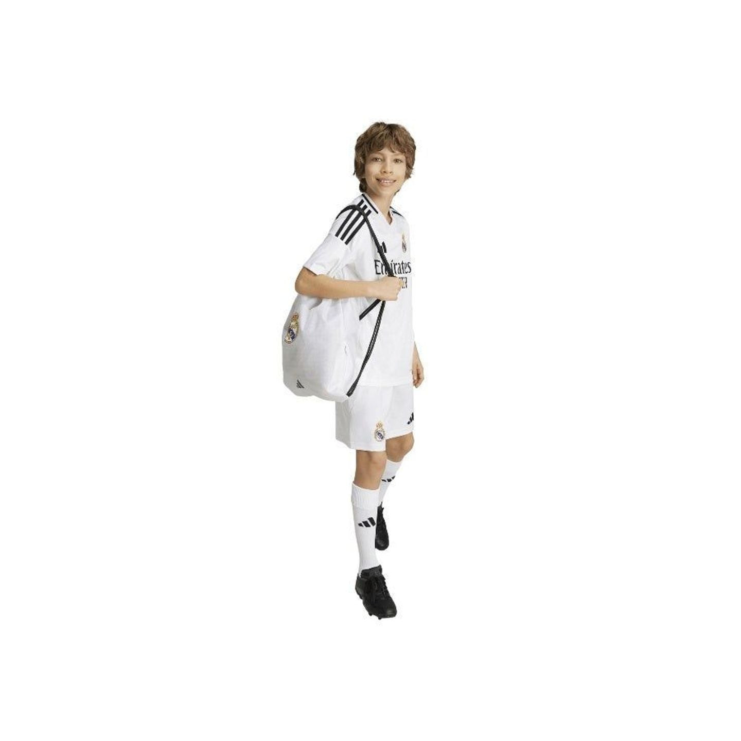 Gros plan lifestyle de mains applaudissant dans un maillot du Real Madrid, avec motif des manches et
