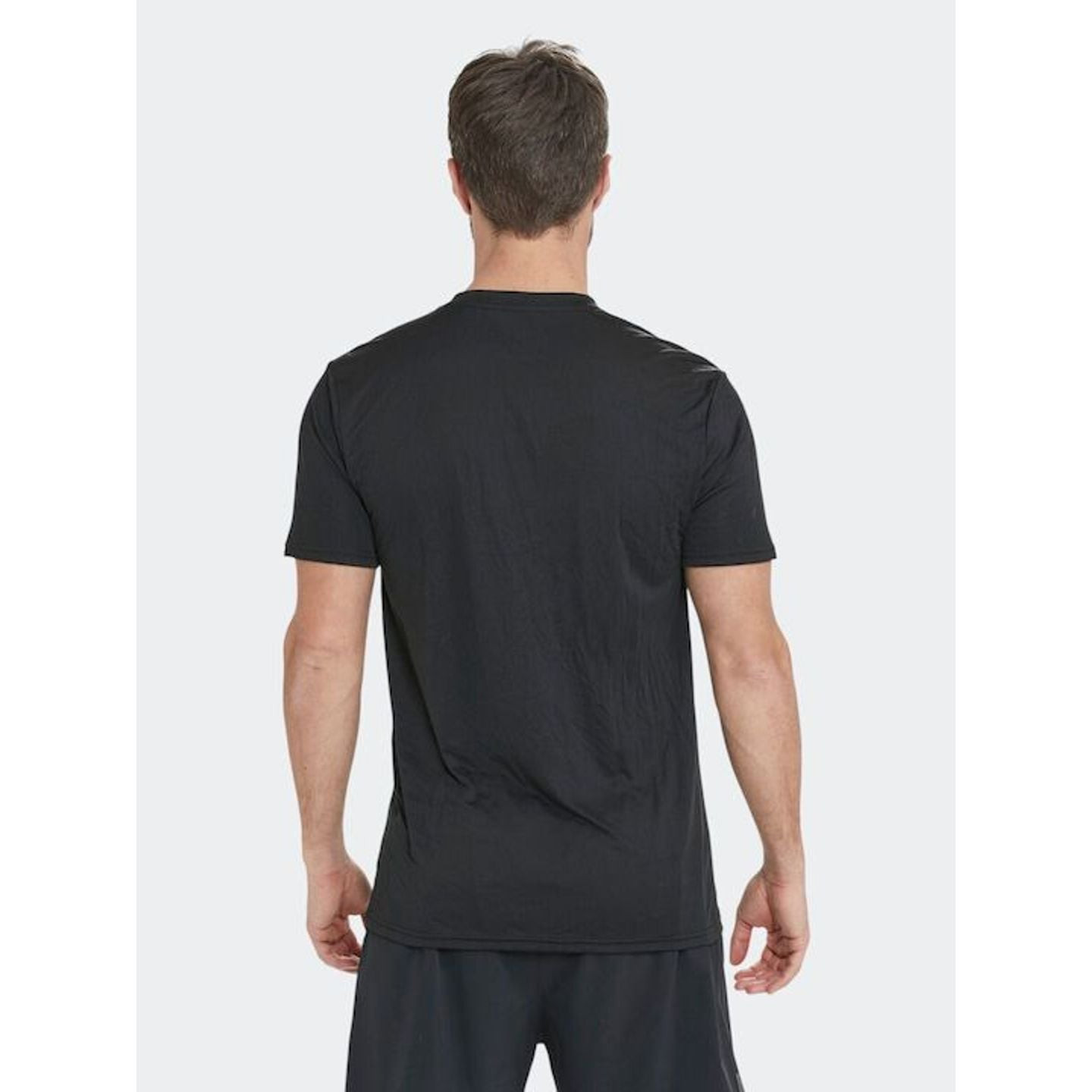 Homme portant l'Endurance T-Shirt De Sport À Manches Courtes Dipose V2 Coupe Ouverte Homme lors d'un