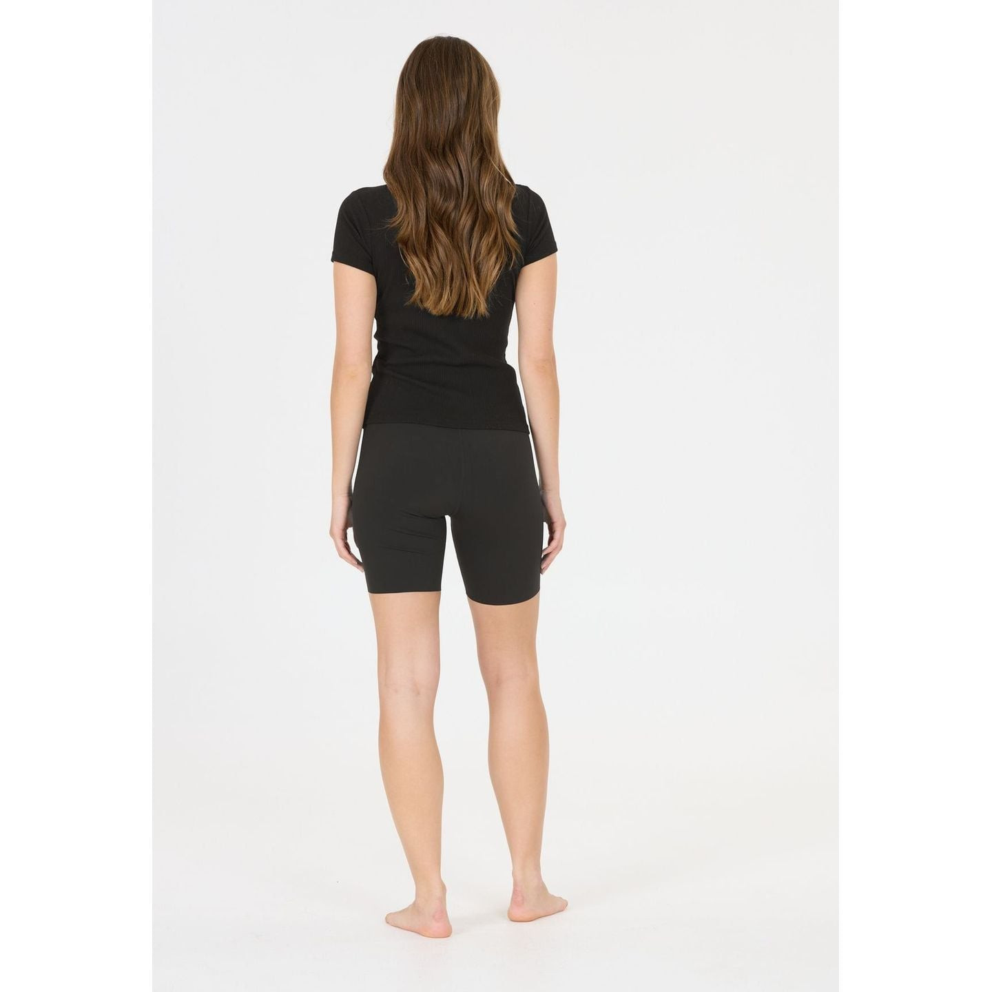 Athlecia Cuissard Court De Sport Bloom V2 Tissu Extensible Femme en mouvement lors d'une séance de s