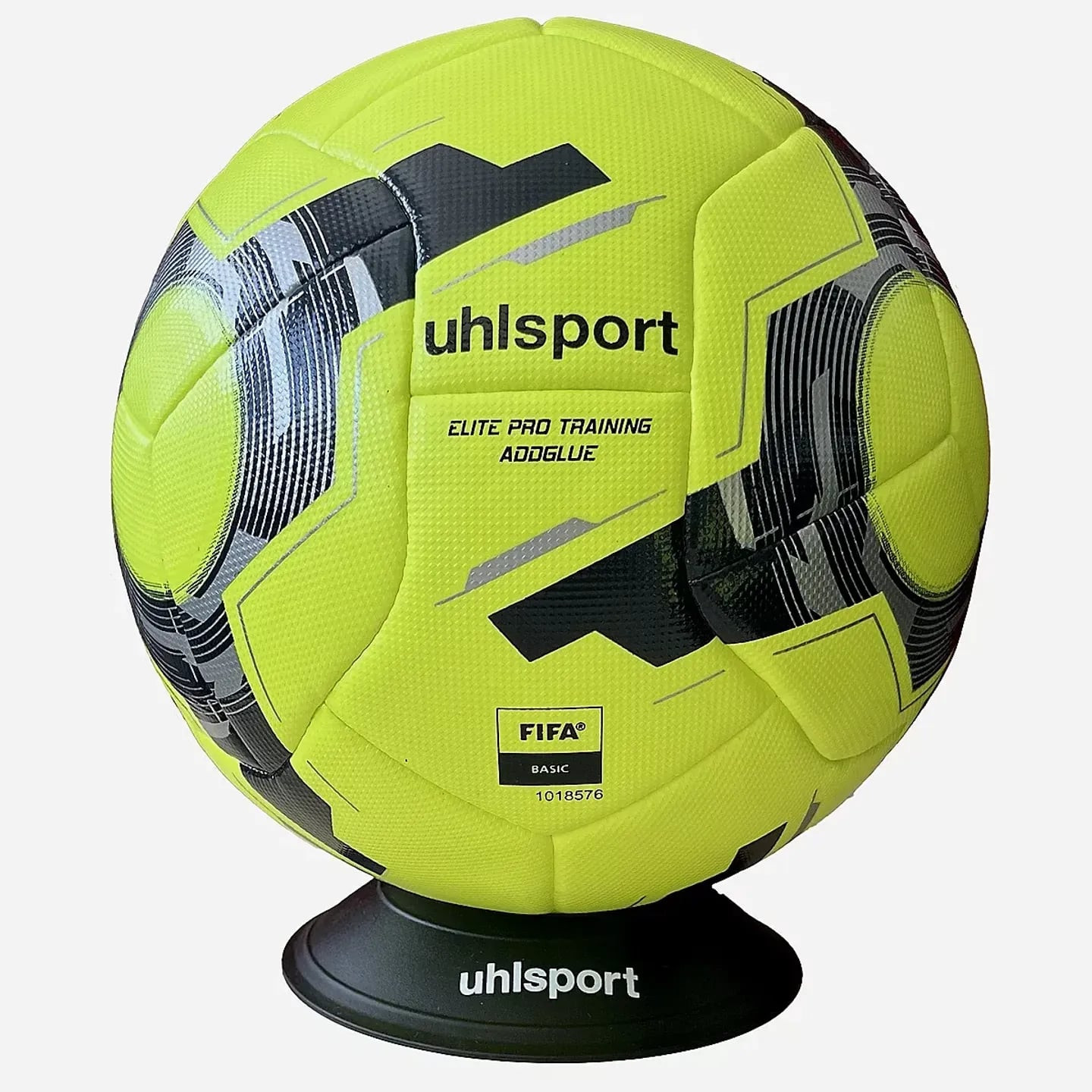 Ballon de football Uhlsport Elite Pro Training 461 jaune fluo sur présentoir noir, marquages ADDGLUE