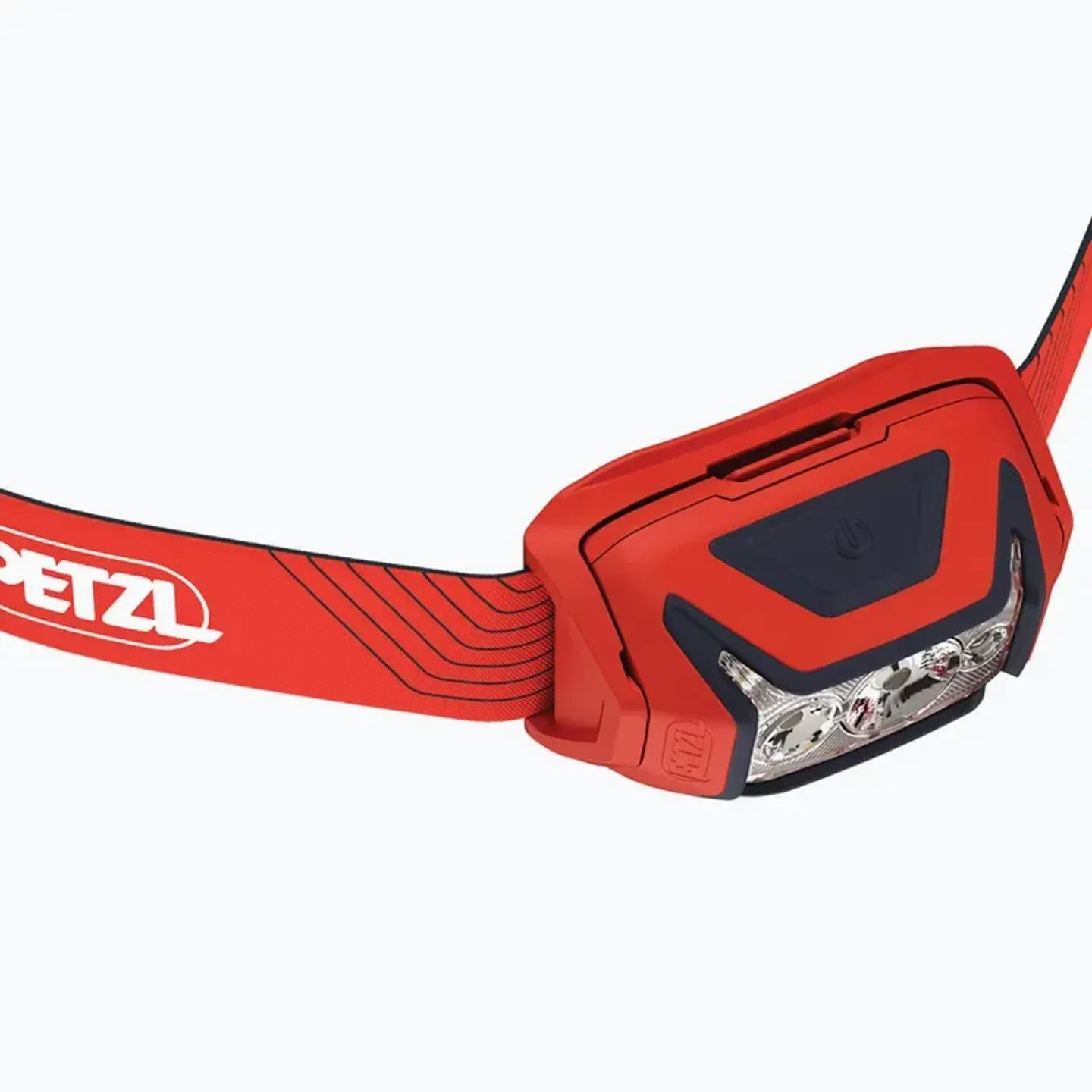 Vue de côté du boîtier rouge de la lampe frontale Petzl Actik avec bouton, lentille et support incli